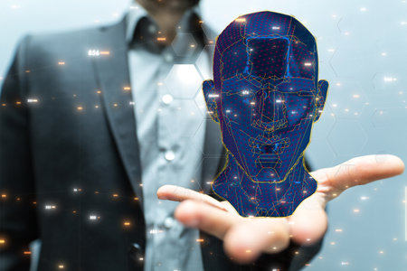 A  man on blurred background holding a human head and brain with artificial intelligence conceptの写真素材