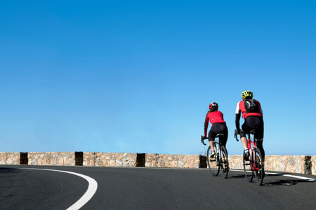 The two cyclists driving on the road. Palma de Mallorcaの写真素材