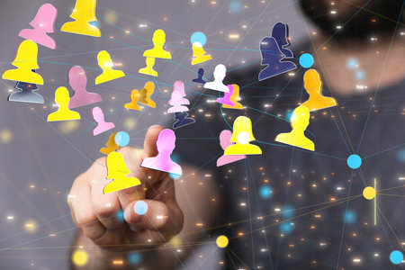 A male hand clicking on profile icons- the concept of networkingの写真素材