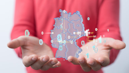 A 3D rendering of a digital map of the German map with digits floating on a man's handの写真素材