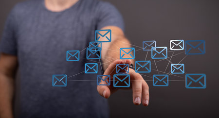 A male's hand pointing to illustrated email inboxesの写真素材