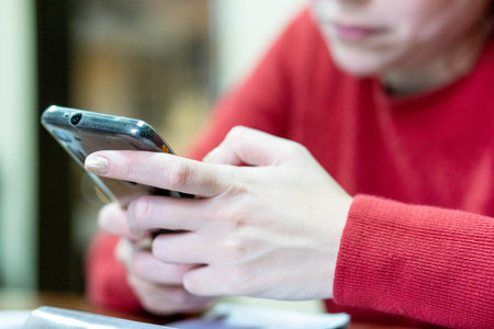 A closeup shot of telephone on woman handの写真素材