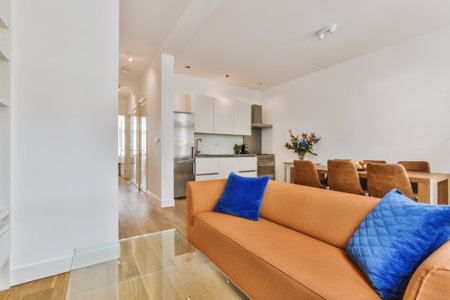 A beautiful image of the living room and kitchen area in a white interior design house; design ideas