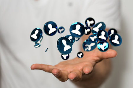 A male hand holding profile icons- the concept of networkingの写真素材