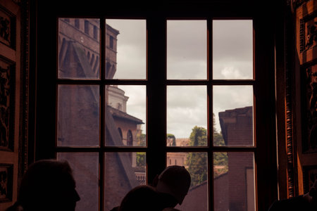An old town from an antique window in a dark roomの写真素材