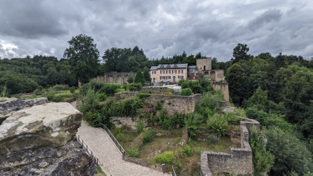 A beautiful view of Larochette Castel Luxembourg under the blue skyの写真素材