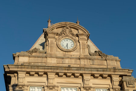 The Sao Bento Railway Station building facade against a blue sky in Porto, Portugalの写真素材