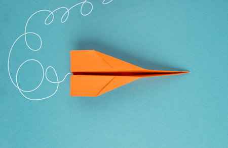 Airplanes in front of a blue colored background, business concept, start new ideasの写真素材