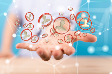 A male's hand holding illustrated conference team work connection digital conceptの写真素材