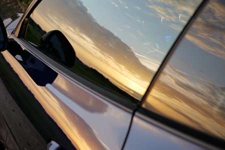 A reflection of sunset scene on the car windowの写真素材