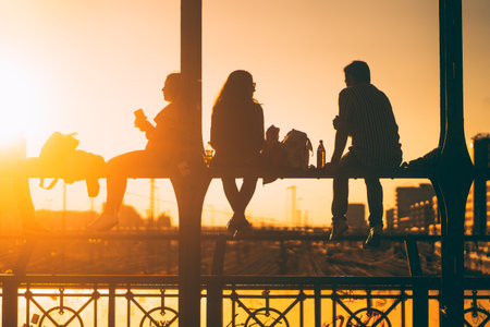 A silhouette of people watching the sunset in Munich, Germany