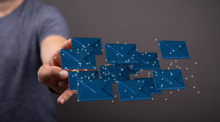 A 3D rendering of beige email icons with hand pointing at it from the background- digital business...