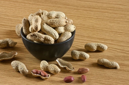 Container full of freshly roasted peanuts collected from the organic garden.