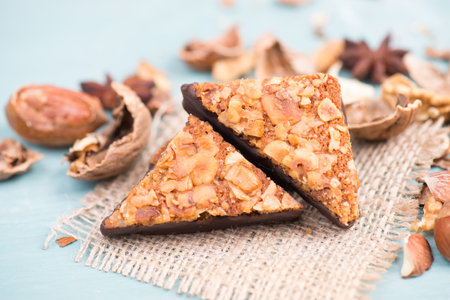 Nut corner, traditional german sweets called Nussecke, covered with chocolate, christmas bakeryの写真素材