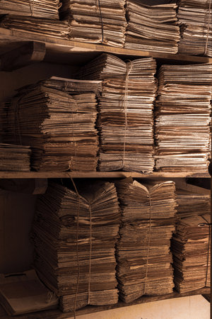 A vertical shot of shelves with old swapped manuscriptsの写真素材