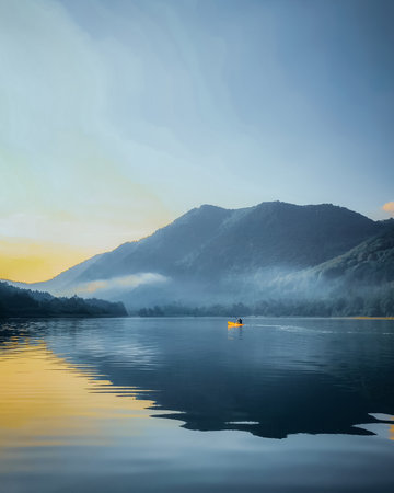 A beautiful shot of a seascape with some mountains in the backgroundの写真素材