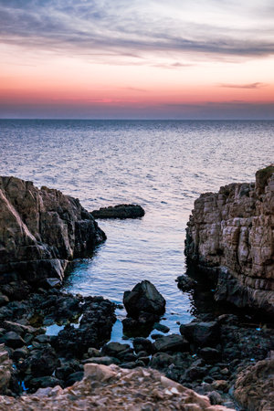 A vertical shot of the sea at sunsetの写真素材