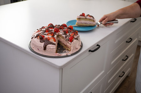 process of making a strawberry cake in a white kitchen all ingredients