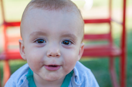 A portrait of a cute little Caucasian kid outdoors.の写真素材