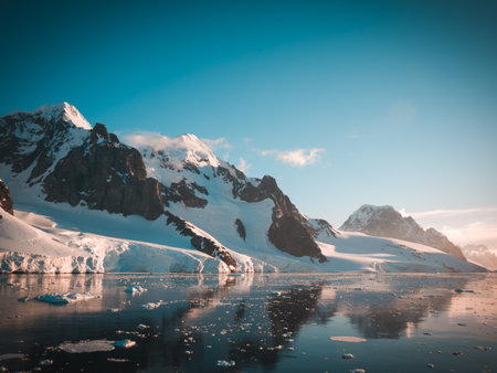 A beautiful landscape with snowy mountains and glaciers in Antarcticaの写真素材