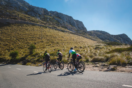 The four cyclists driving on the road. Palma de Mallorcaの写真素材