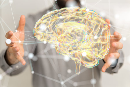 A digital brain icon floating in the air on a blurred backgroundの写真素材