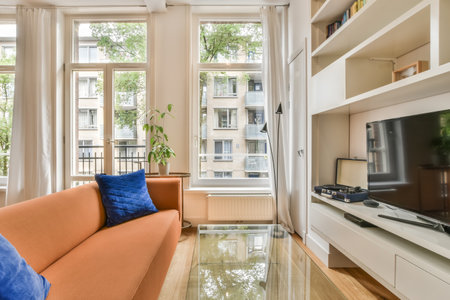 A beautiful image of a living room area with floor-to-ceiling windows in a white interior design...