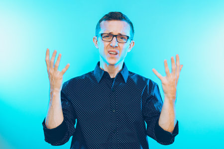An American man in a shirt with an annoyed face