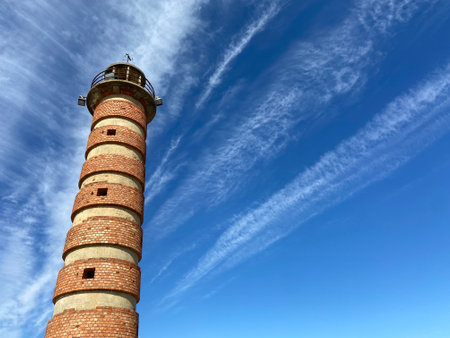 The view of the lighthouse against the background of blue sky. Lisbon, Portugal.の写真素材