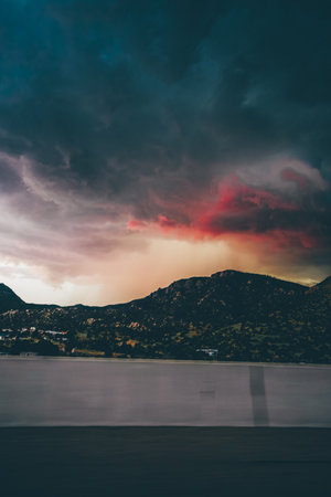 A scenic ombre cloudscape over a mountain at duskの写真素材