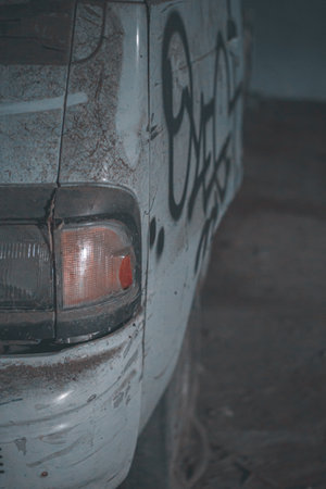A closeup shot of a white dirty abandoned carの写真素材