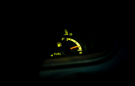 Photo of lit up fuel gauge in a vehicle.