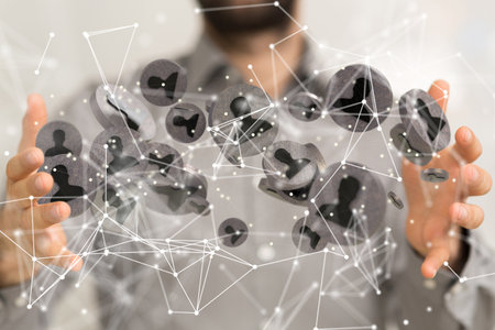 A 3D rendering of digital human icons with hand pointing at it from the background- digital business communication conceptの写真素材