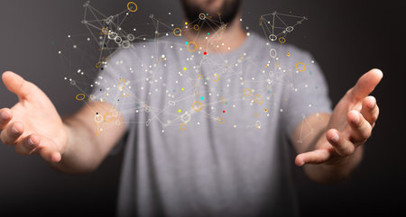 The 3d rendered network connection dots and lines hovering over the man's handsの写真素材