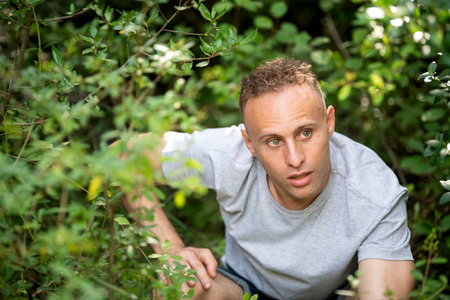 Portrait to a young adult boy in the middle of natureの写真素材