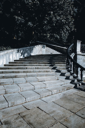 A vertical shot of empty stairs in a sunny park