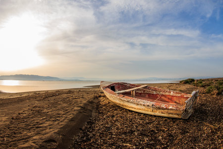 An old weathered wooden boat on the beachの写真素材