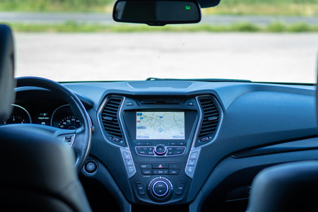 A modern interior of an automobile with the dashboard
