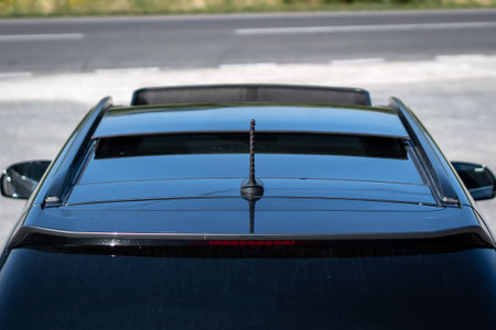 A selective of a dark automobile on the street