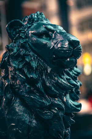 A vertical shot of a lion figurine against a blurred backgroundの写真素材