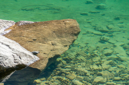 A view of beautiful clear lagoon water with stones