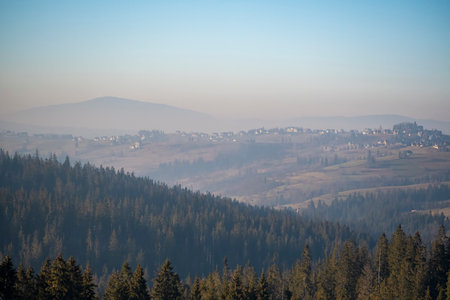 A scenic view of a foggy forest and mountain landscape  in the countrysideの写真素材