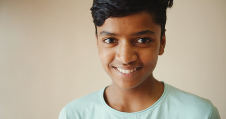 A portrait of a handsome hapyoung boy from Indiaの写真素材