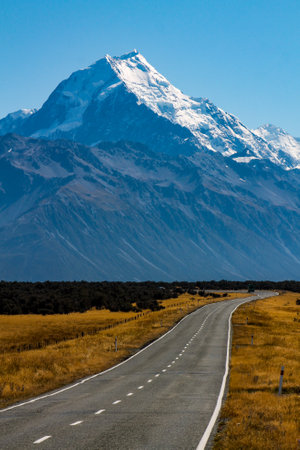 A beautiful view of a mountainous landscape with an empty road