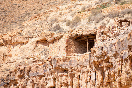 Scenic view of Old stone houses, Palm trees Oasis , Mountains from Ghoufi Canyon in the Aures region, Algeriaの写真素材