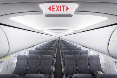 Interior view of passenger airplane A320 with exit signの写真素材