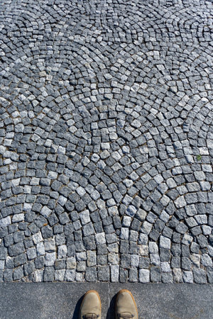 A close-up shot of a gray cobblestone textureの写真素材