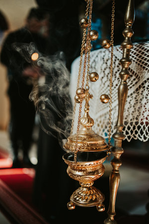 A closeup of censer in church with incenseの写真素材