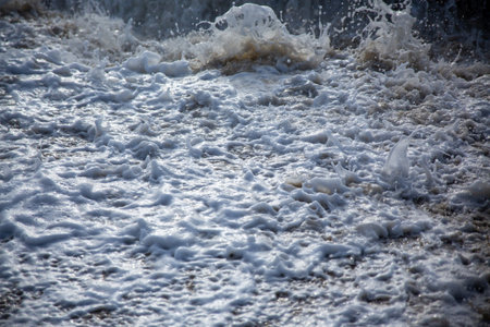 A closeup of the water foam. Ocean pattern.