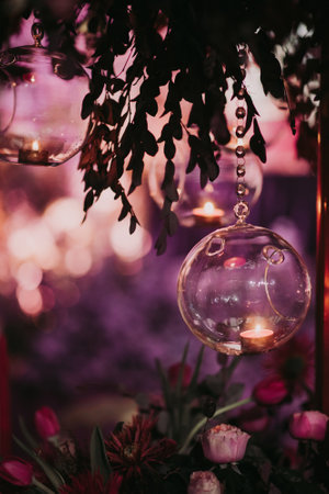 A selective of a hanging candle in a glass ballの写真素材
